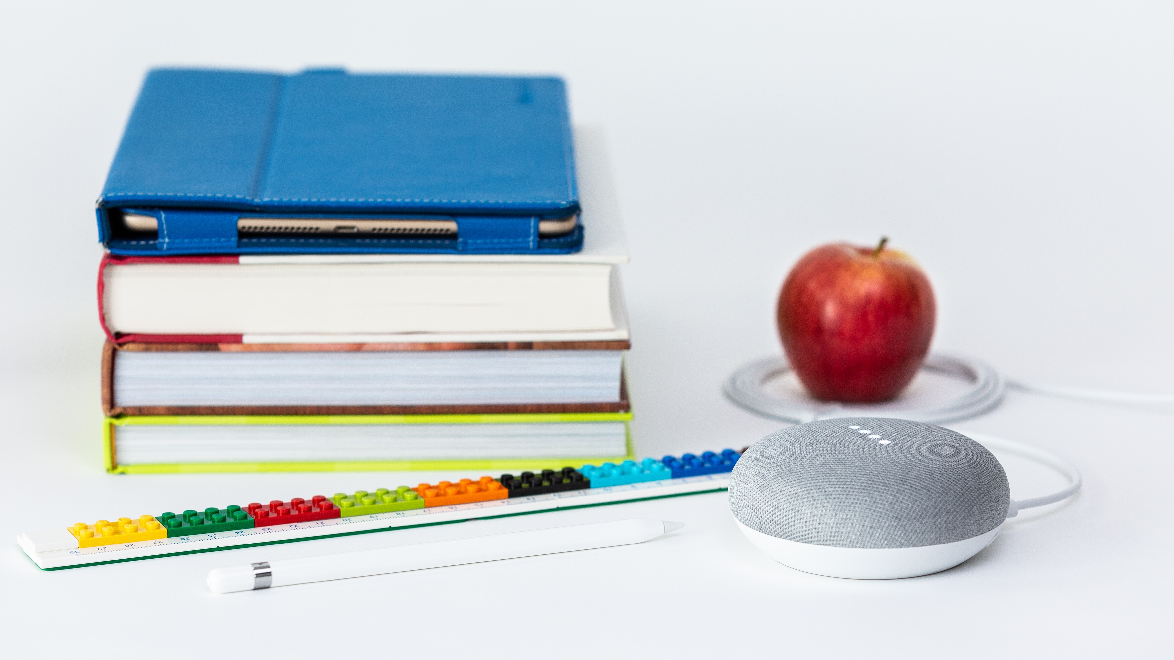 books, apple, and smart speaker